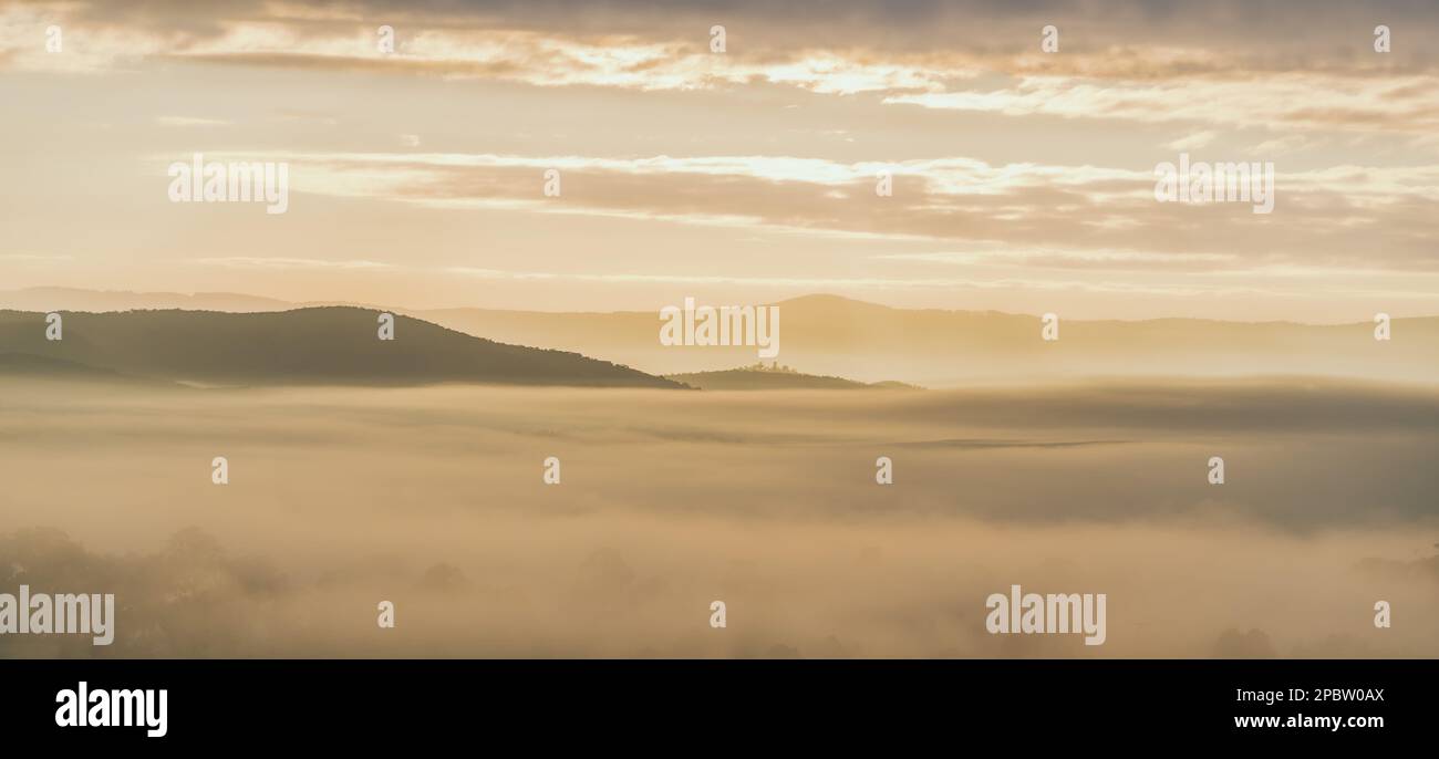 Misty view of mountains in cloud Stock Photo