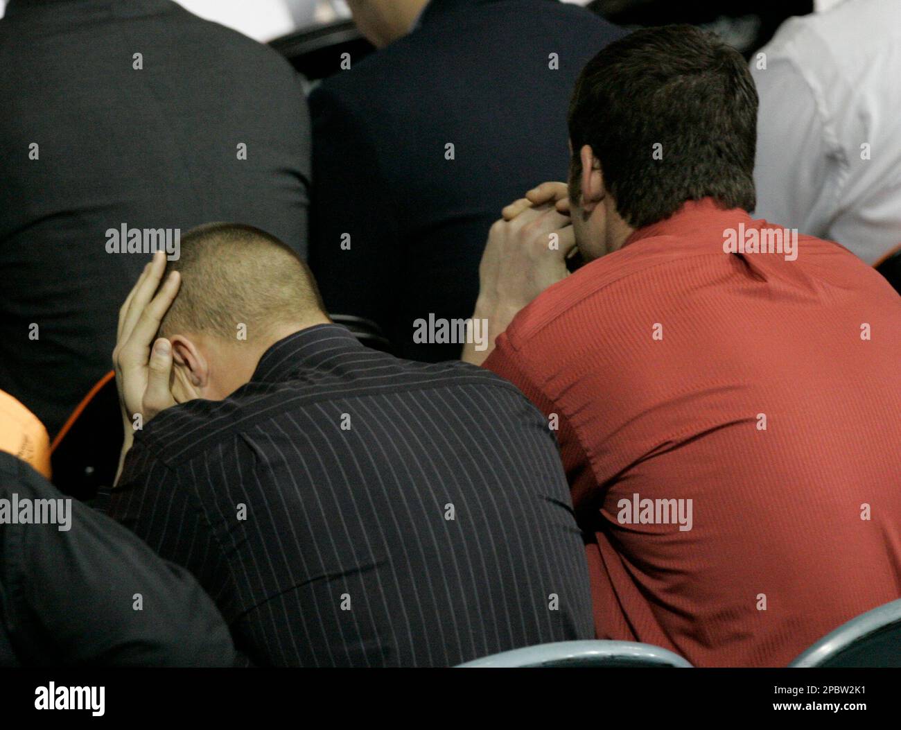 Bluffton University baseball players gather Wednesday, March 7, 2007 as a funeral service for