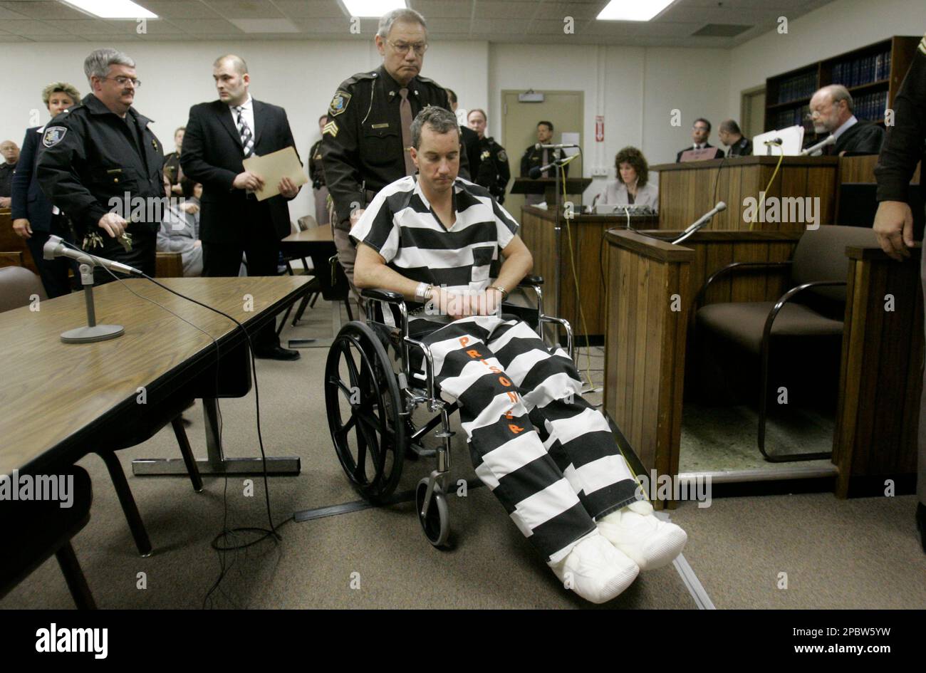 Stephen Grant is escorted out of his arraignment before Judge 