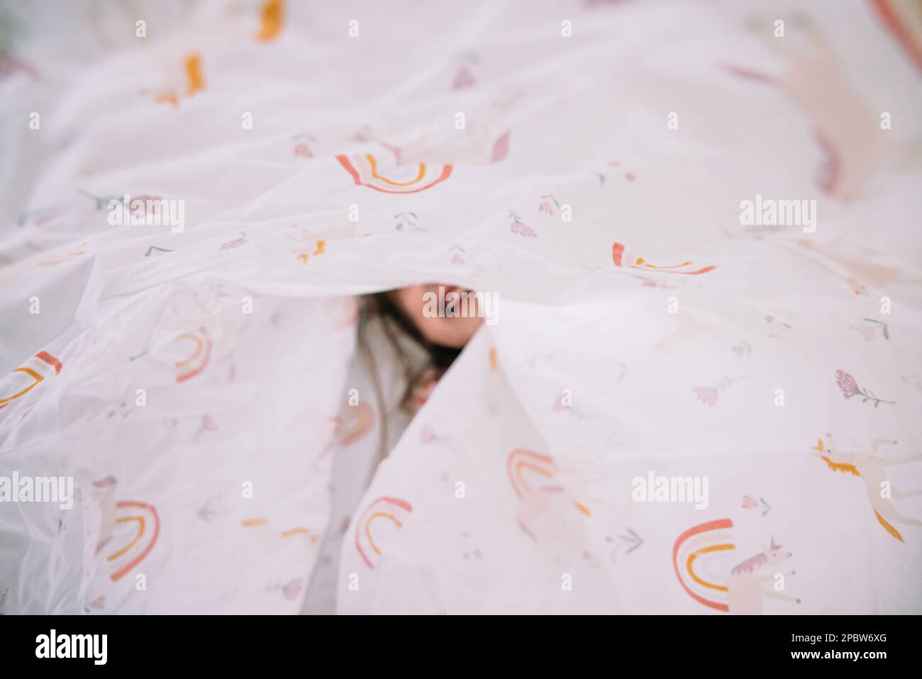 Playing in the sheets making a tent stock photo alamy