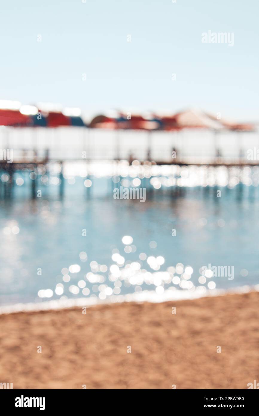 Beach blurred vertical background. Tropical island paradise. Sandy shore  washing by the wave. Blue ocean water. Dreams summer vacations destination  Stock Photo - Alamy