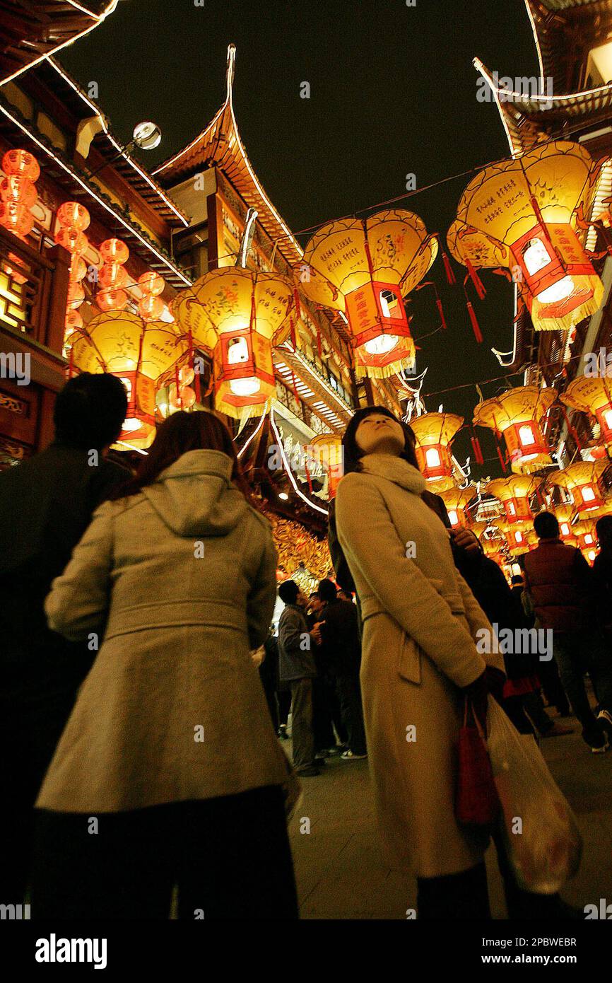 Visitors walk under the lanterns during the lantern festival in the ...