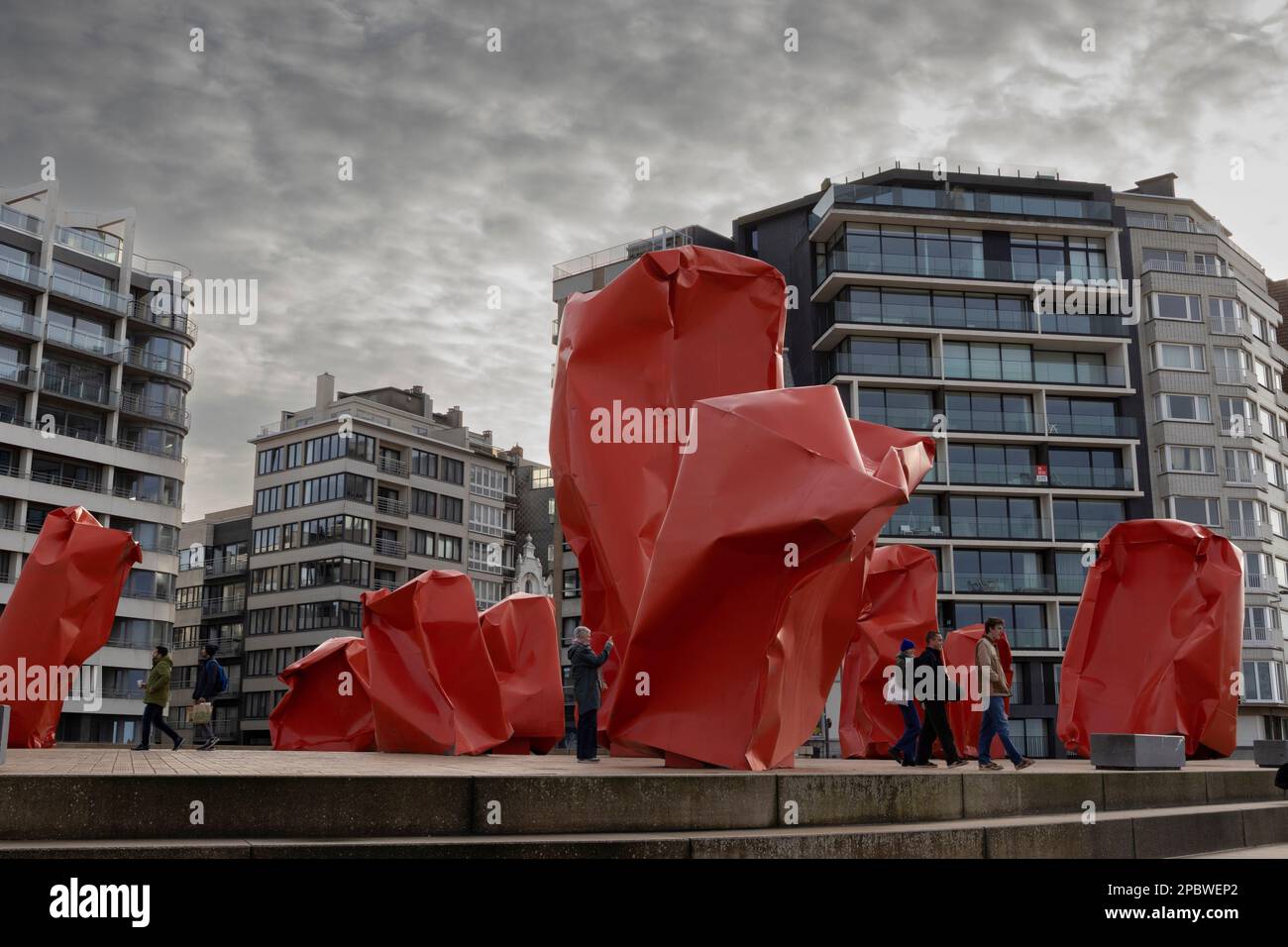 OSTEND, BELGIUM, 3 JANUARY 2023: Public artwork 'Rock Strangers' by Arne Quinze and surrounding buildings on the promenade of Ostend. Ostend is a popu Stock Photo