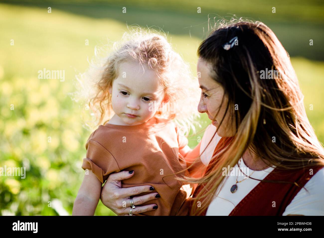 Mom & Daughter in Flower Field in San Diego Stock