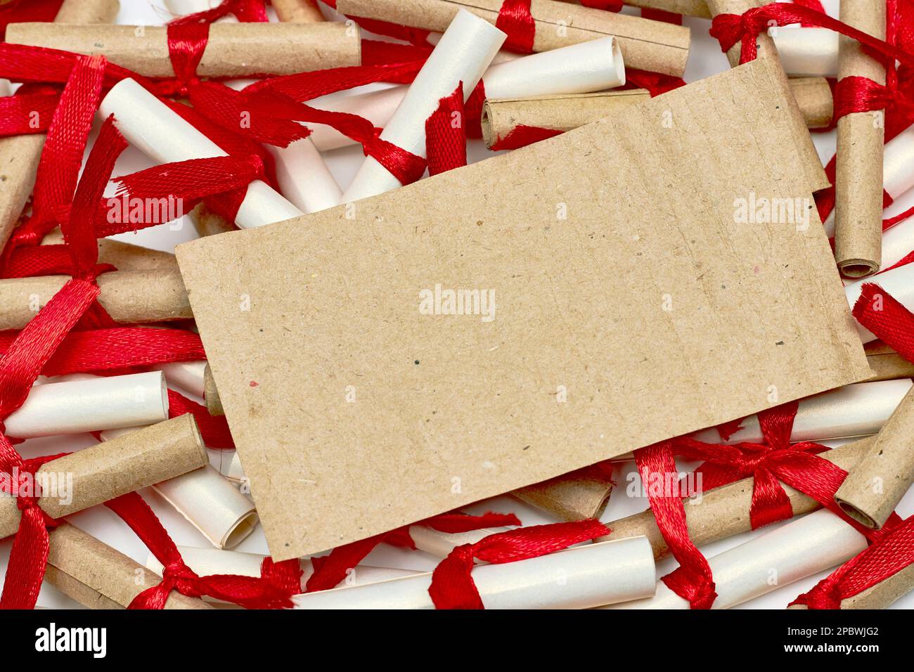 Romantic scrapbook letters love notes tied with a red satin ribbon. Mockup for design Stock