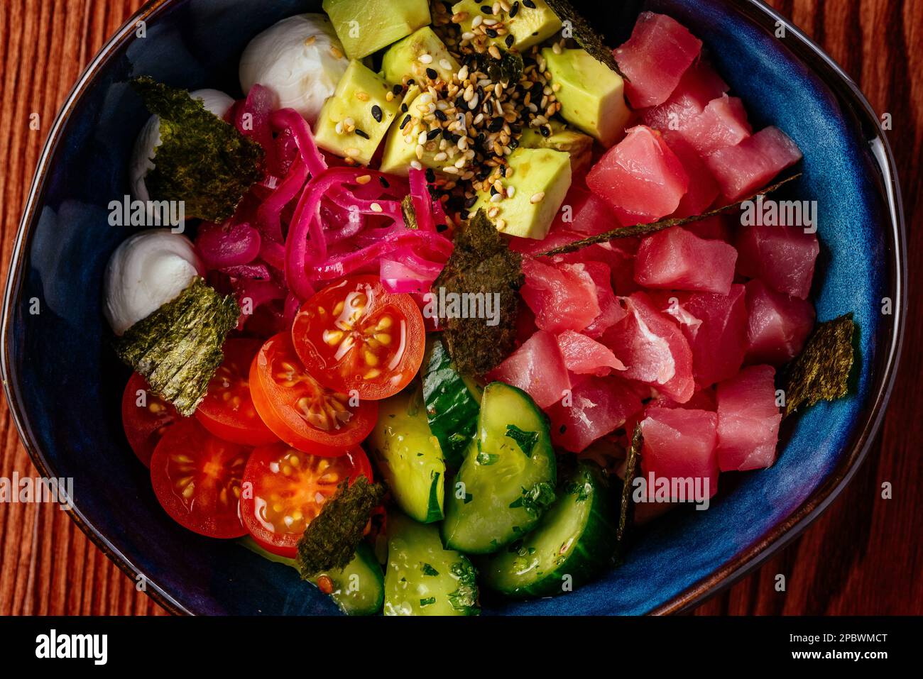 hawaiian poke bowl with tuna, vegetables, rice Stock Photo - Alamy