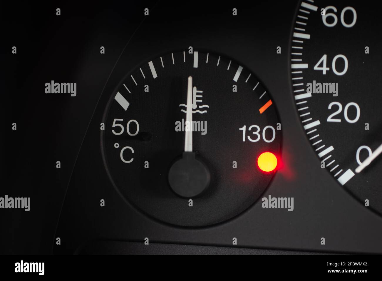 Car radiator water temperature gauge scale with orange reserve light on