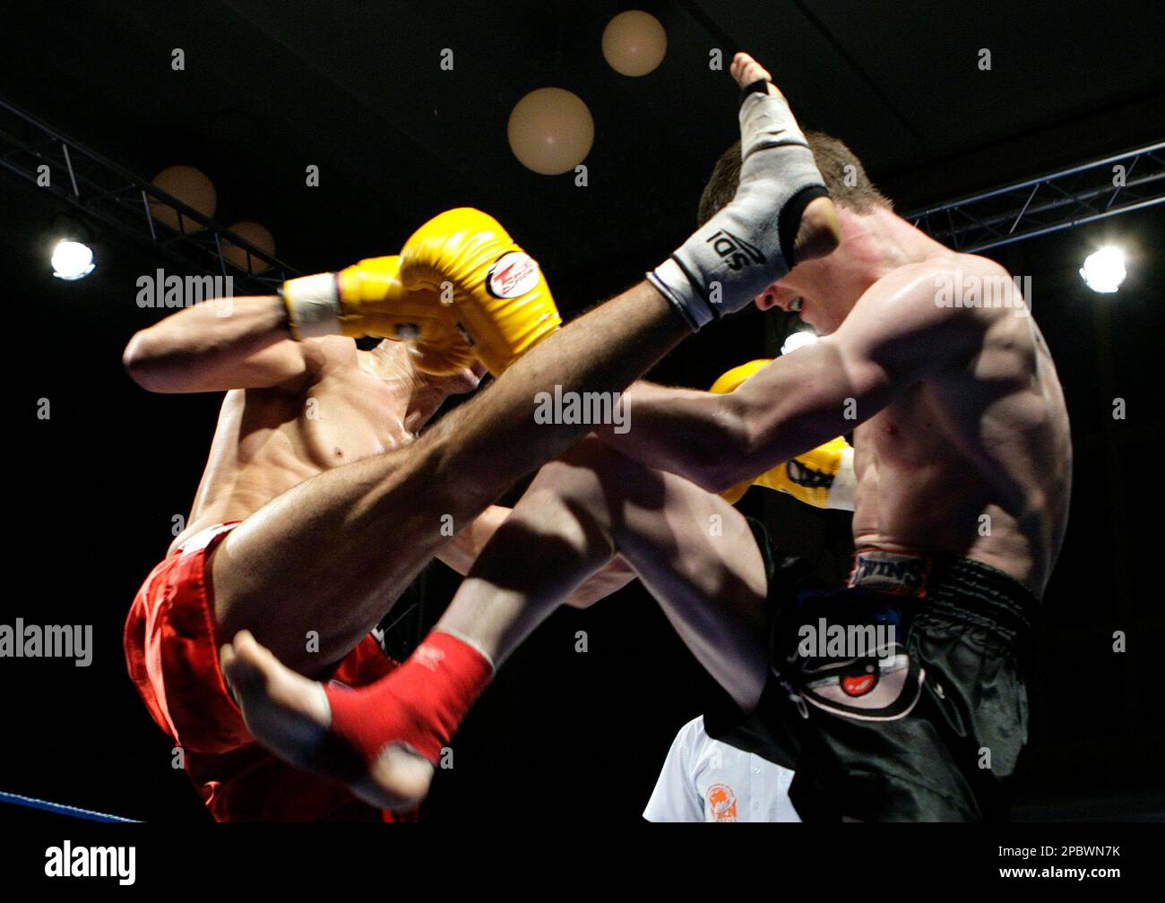 Swiss Farid M'Laika from the Boxing Club Yamabushi of Geneva,left, fights  against Jamie Crawford from Northern Ireland, right, for the european  semifinal of the World Kickboxing Network WKN, in the super middlelight