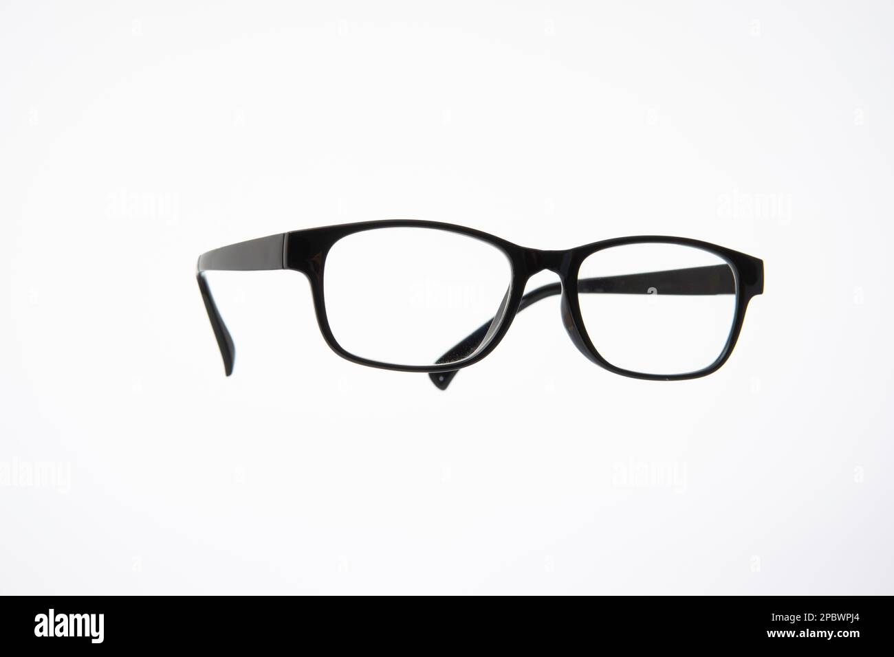 Black plastic frame eyeglasses. Close up studio shot, isolated on white