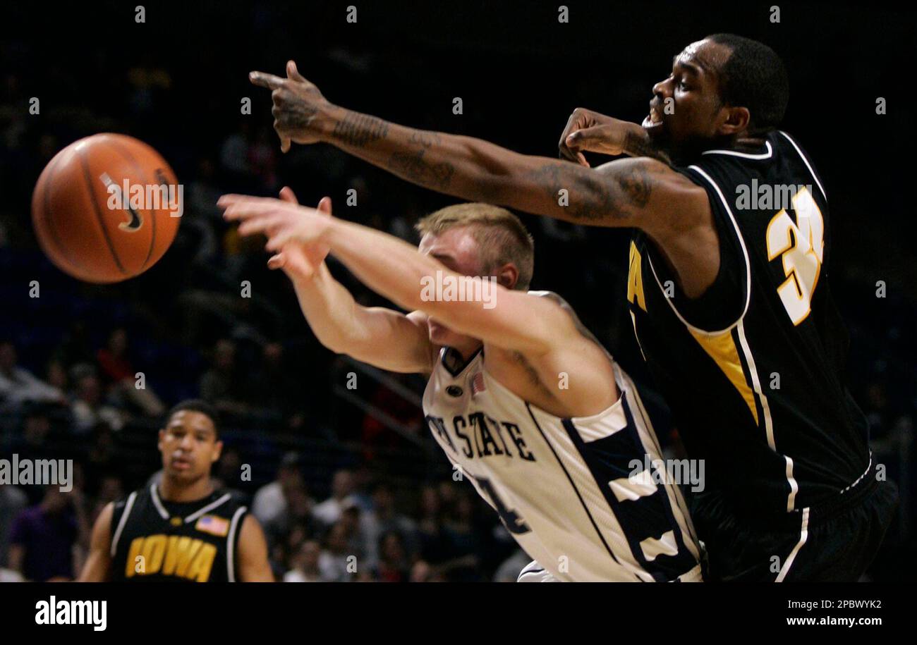 Iowa forward Tyler Smith, right, blocks a pass to Penn State guard Ben