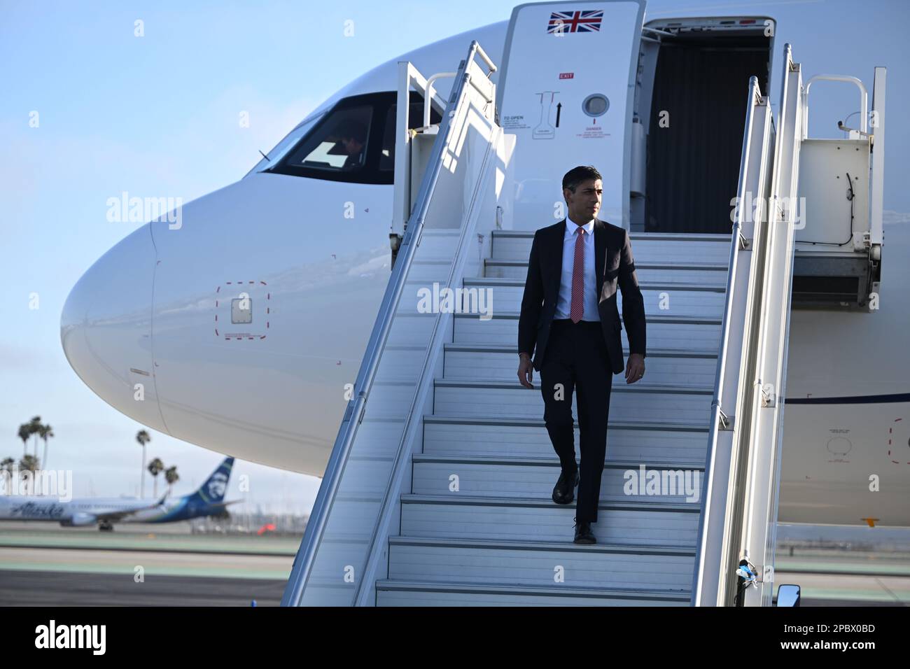 Prime Minister Rishi Sunak disembarks his plane as he arrives in San ...