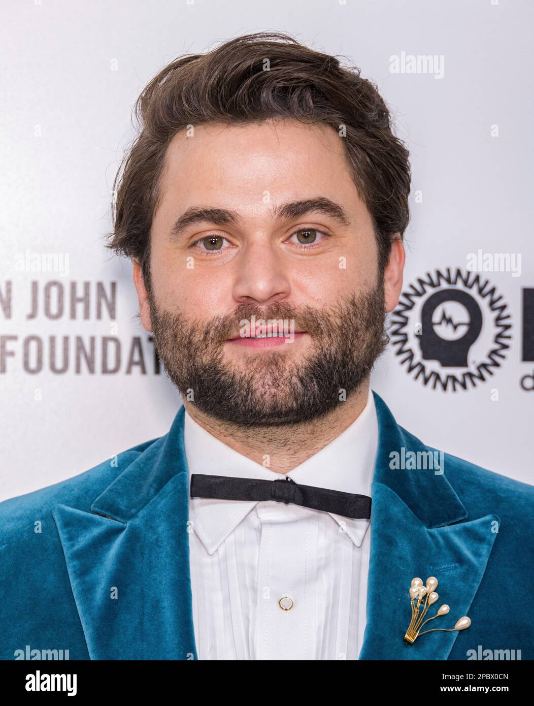 Jake Borelli arrives at the Elton John AIDS Foundation's 31st Annual