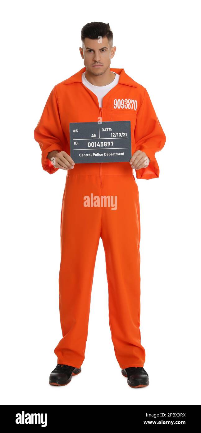 Prisoner in orange jumpsuit with mugshot letter board on white background Stock Photo