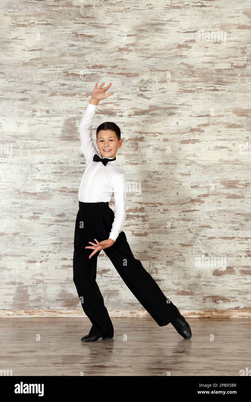 Beautifully dressed little boy dancing in studio Stock Photo Alamy