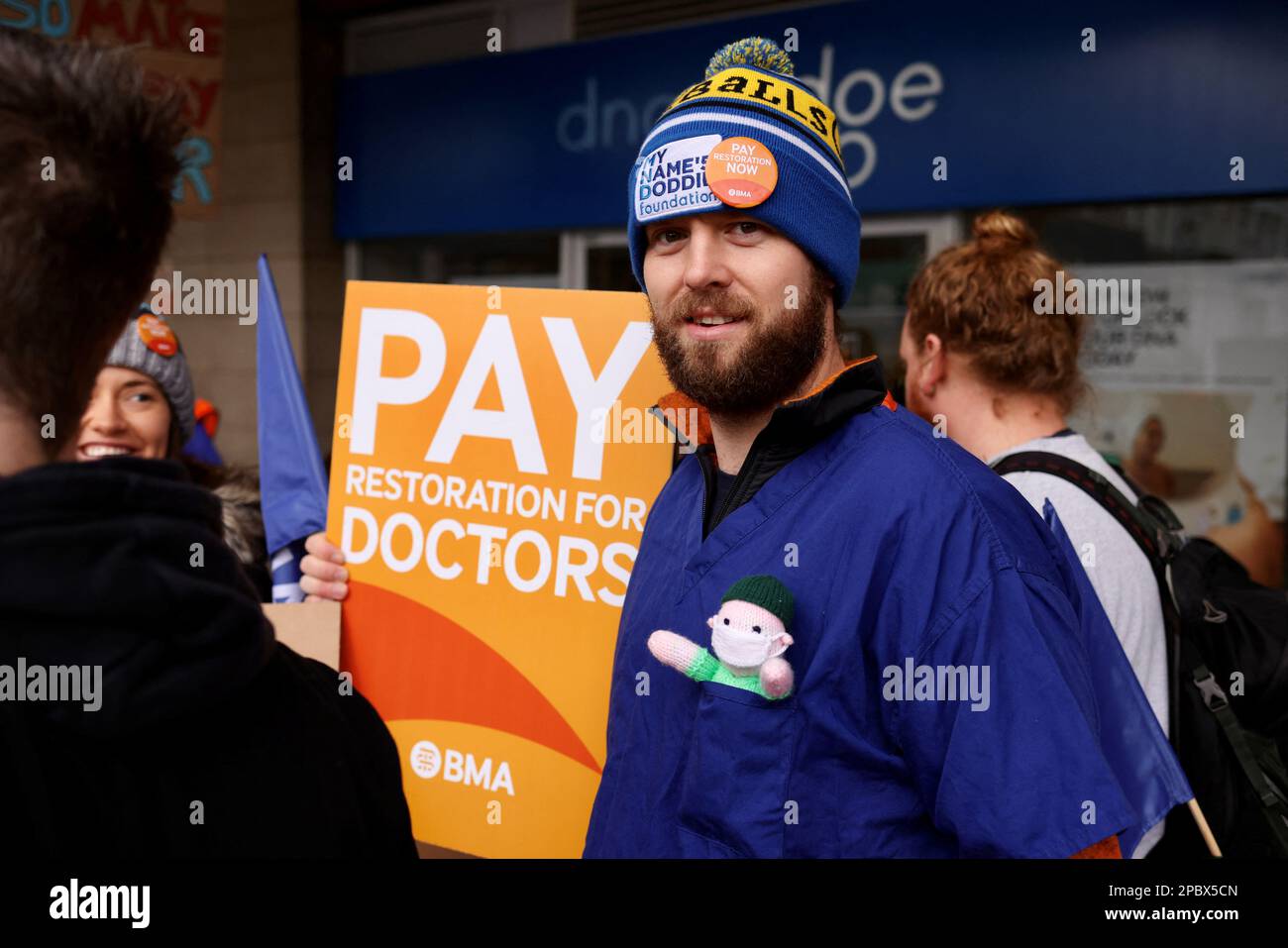 Junior Doctor Alisdair Love has a knitted doll in his pocket made by