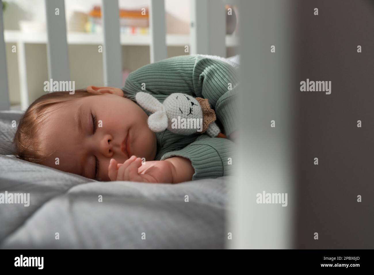 Cute little baby sleeping in crib at home. Bedtime Stock Photo Alamy
