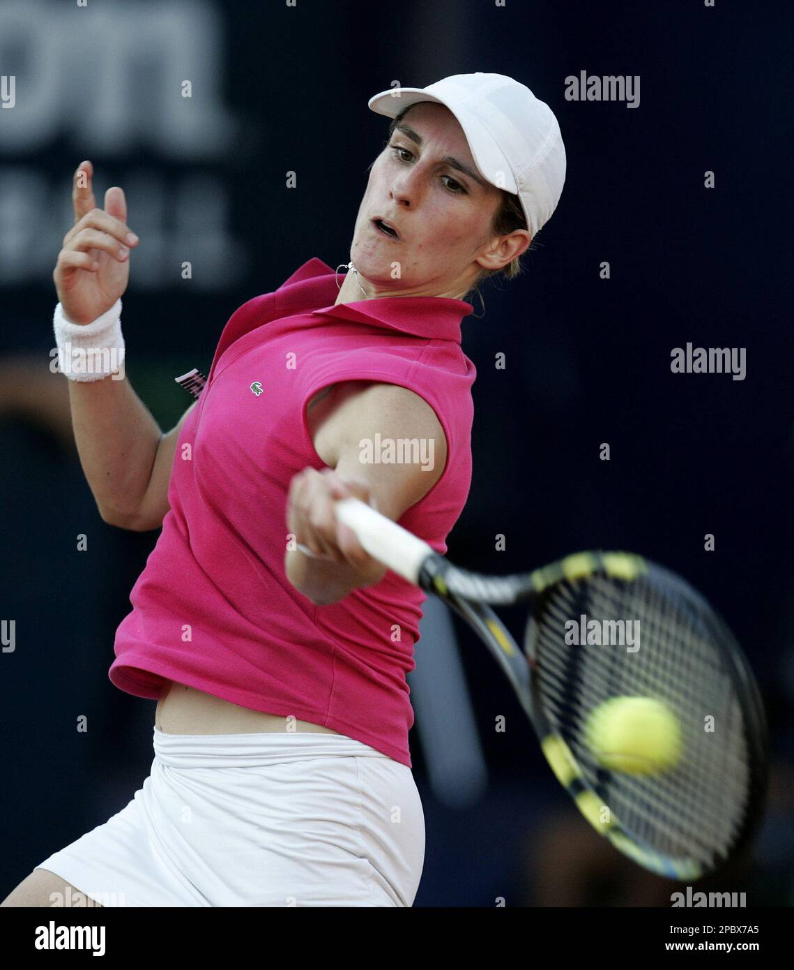 France's Emilie Loit returns the ball to Daniela Munoz of Mexico during a Mexico Tennis Open game in Acapulco, Mexico, Monday, Feb. 26, 2007. (AP Photo/Eduardo Verdugo) Stock Photo