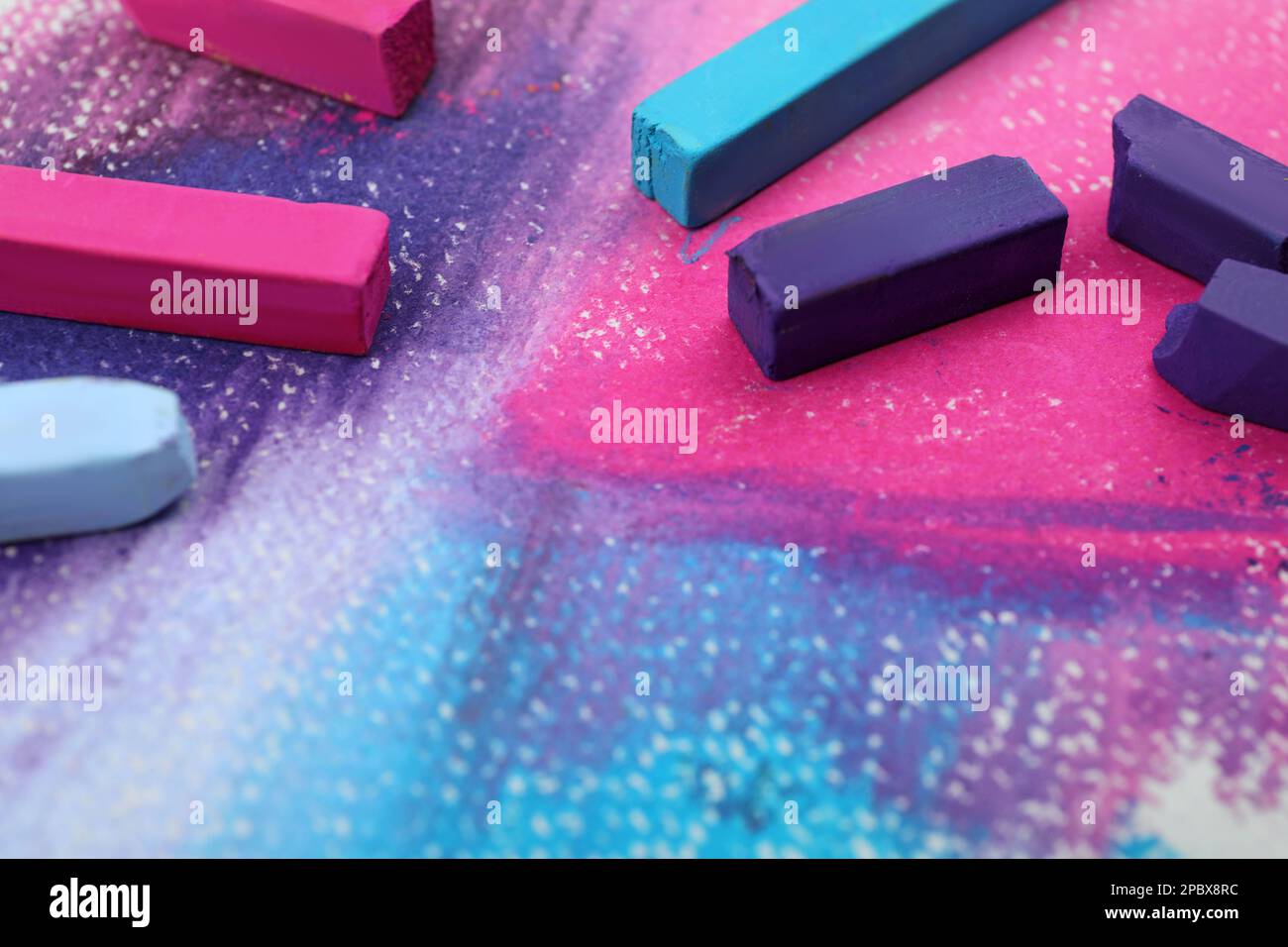 Colorful pastel chalks on abstract painting, closeup. Drawing materials Stock Photo Alamy