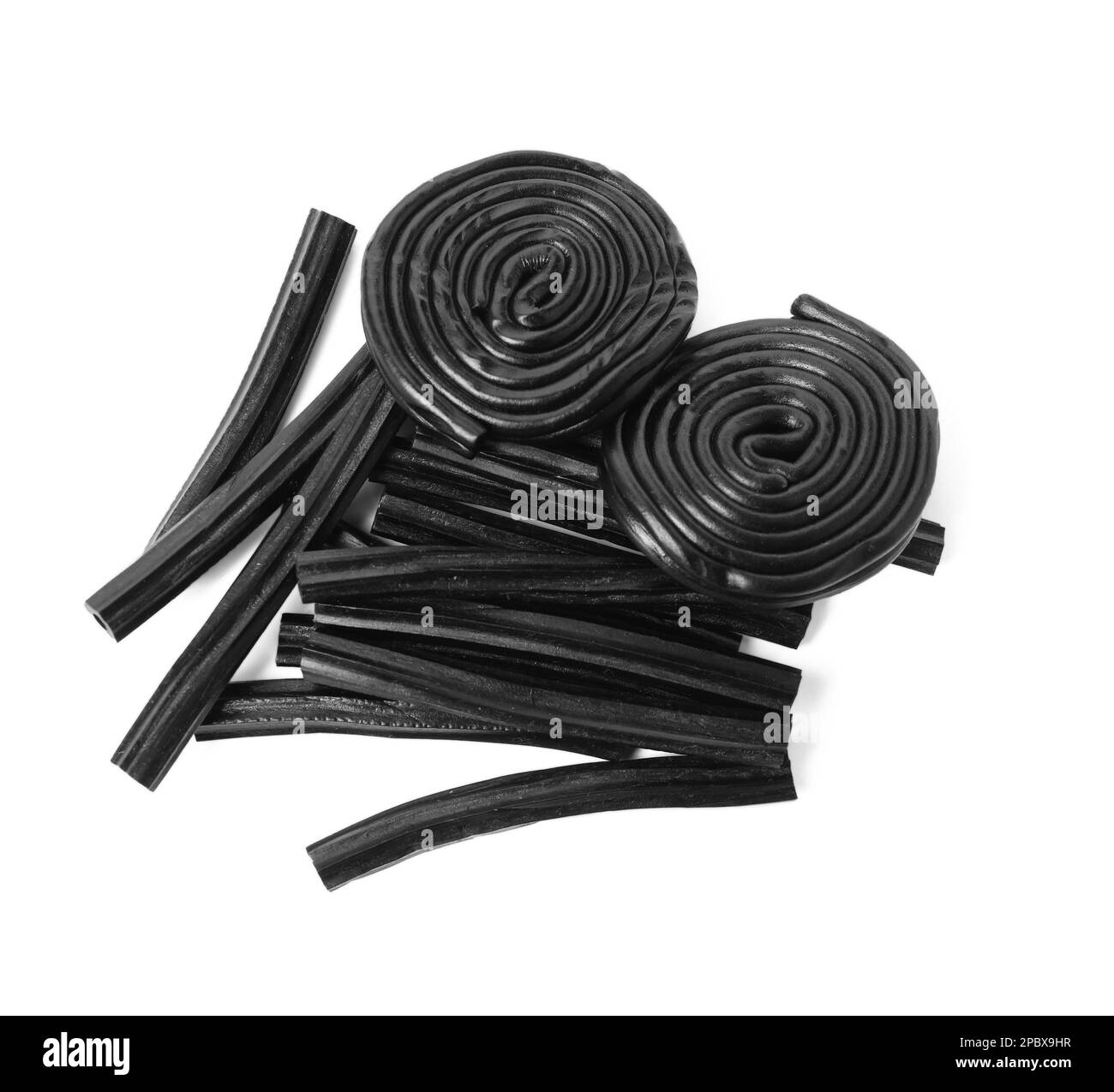 Tasty black liquorice candies on white background, top view Stock Photo