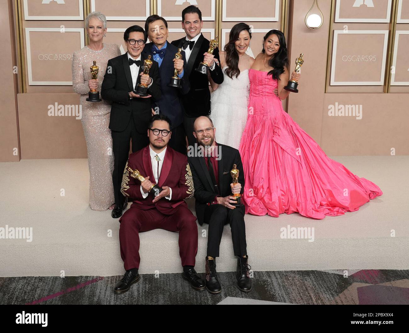 Los Angeles, USA. 12th Mar, 2023. (Top L-R) The cast and crew of 'Everything Everywhere All at Once' Jamie Lee Curtis, Ke Huy Quan, James Hong, Jonathan Wang, Michelle Yeoh, Stephanie Hsu, (Bottom L-R) Daniel Kwan and Daniel Scheinert pose with their Oscar trophies in the press room at the The 95th Academy Awards held by the Academy of Motion Picture Arts and Sciences at the Dolby Theatre in Los Angeles, CA on March 12, 2023. (Photo by Sthanlee B. Mirador/Sipa USA) Credit: Sipa USA/Alamy Live News Stock Photo