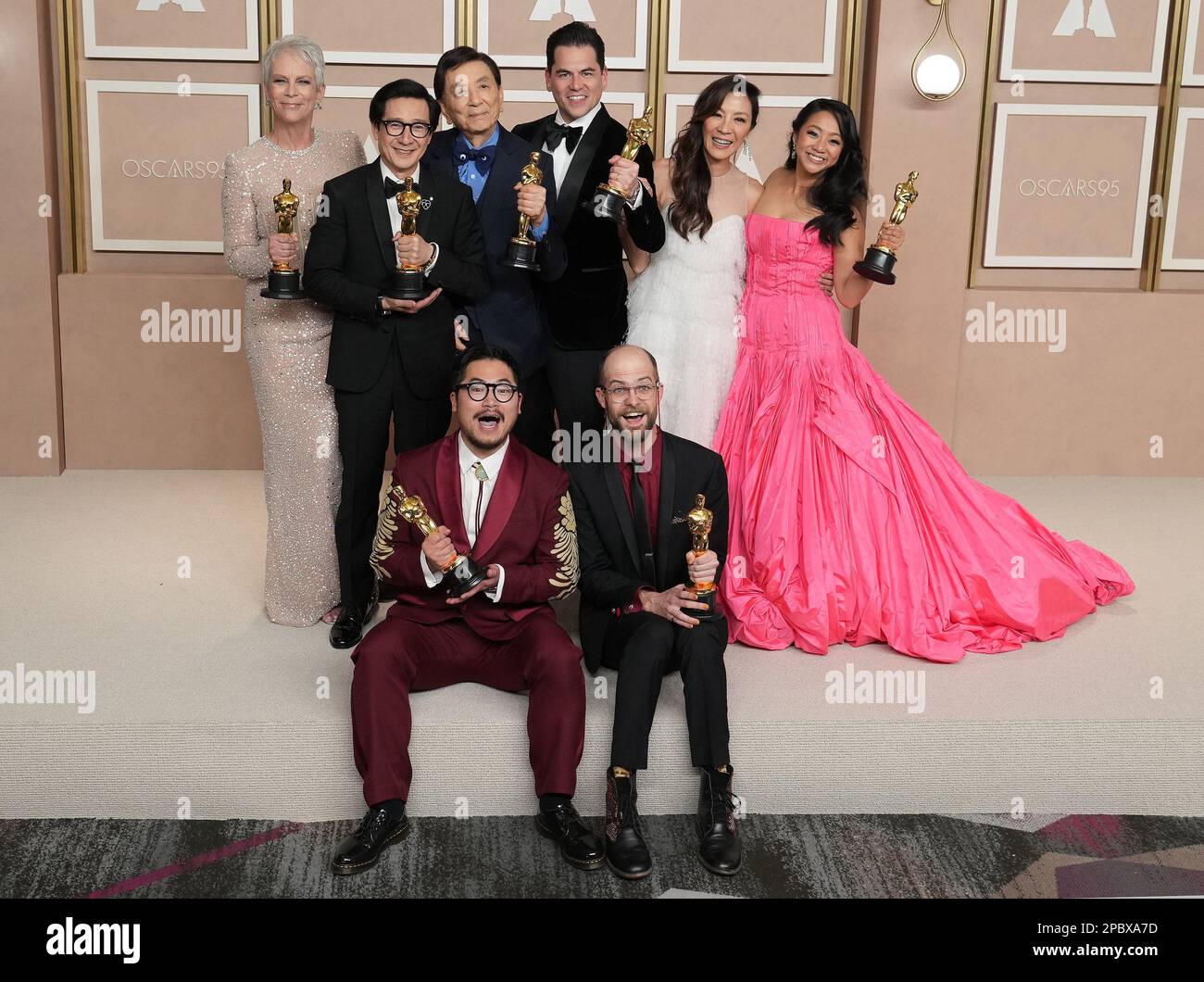 Los Angeles, USA. 12th Mar, 2023. (Top L-R) The cast and crew of 'Everything Everywhere All at Once' Jamie Lee Curtis, Ke Huy Quan, James Hong, Jonathan Wang, Michelle Yeoh, Stephanie Hsu, (Bottom L-R) Daniel Kwan and Daniel Scheinert pose with their Oscar trophies in the press room at the The 95th Academy Awards held by the Academy of Motion Picture Arts and Sciences at the Dolby Theatre in Los Angeles, CA on March 12, 2023. (Photo by Sthanlee B. Mirador/Sipa USA) Credit: Sipa USA/Alamy Live News Stock Photo