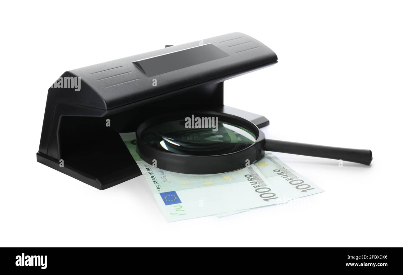 Modern currency detector with Euro banknotes and magnifying glass on ...