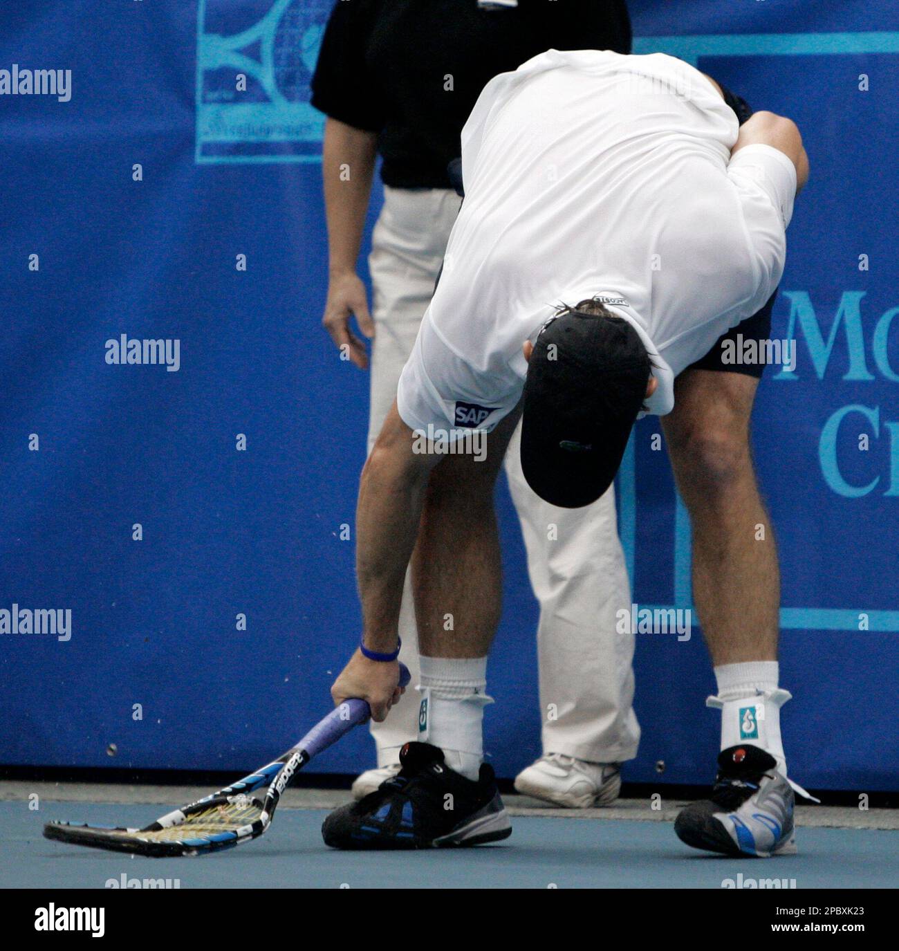 Andy Roddick smashes his racket on the court after losing a point to ...