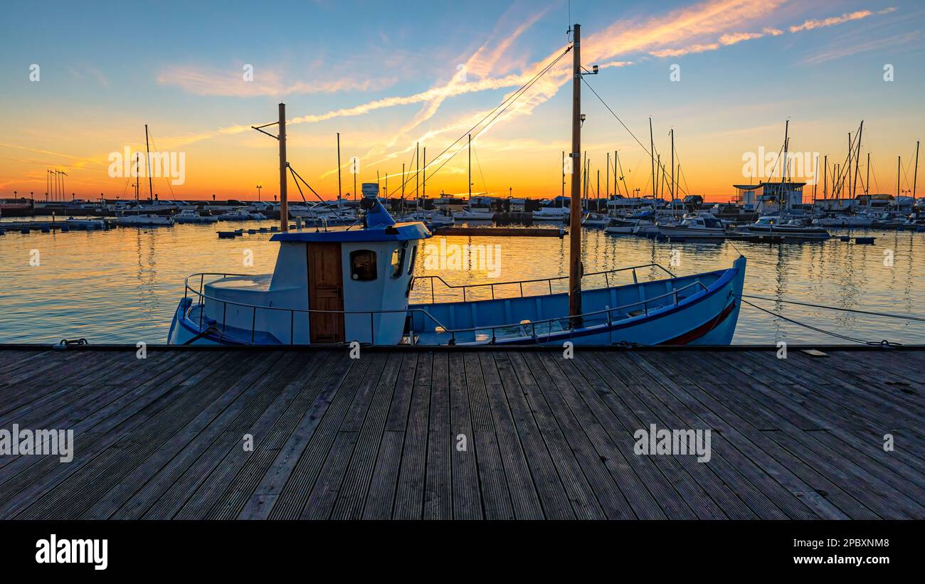 HELSINGBORG, SWEDEN - AUGUST 16, 2019: The north harbour waterfront of Helsingborg with foreground fishing boat Stock Photo