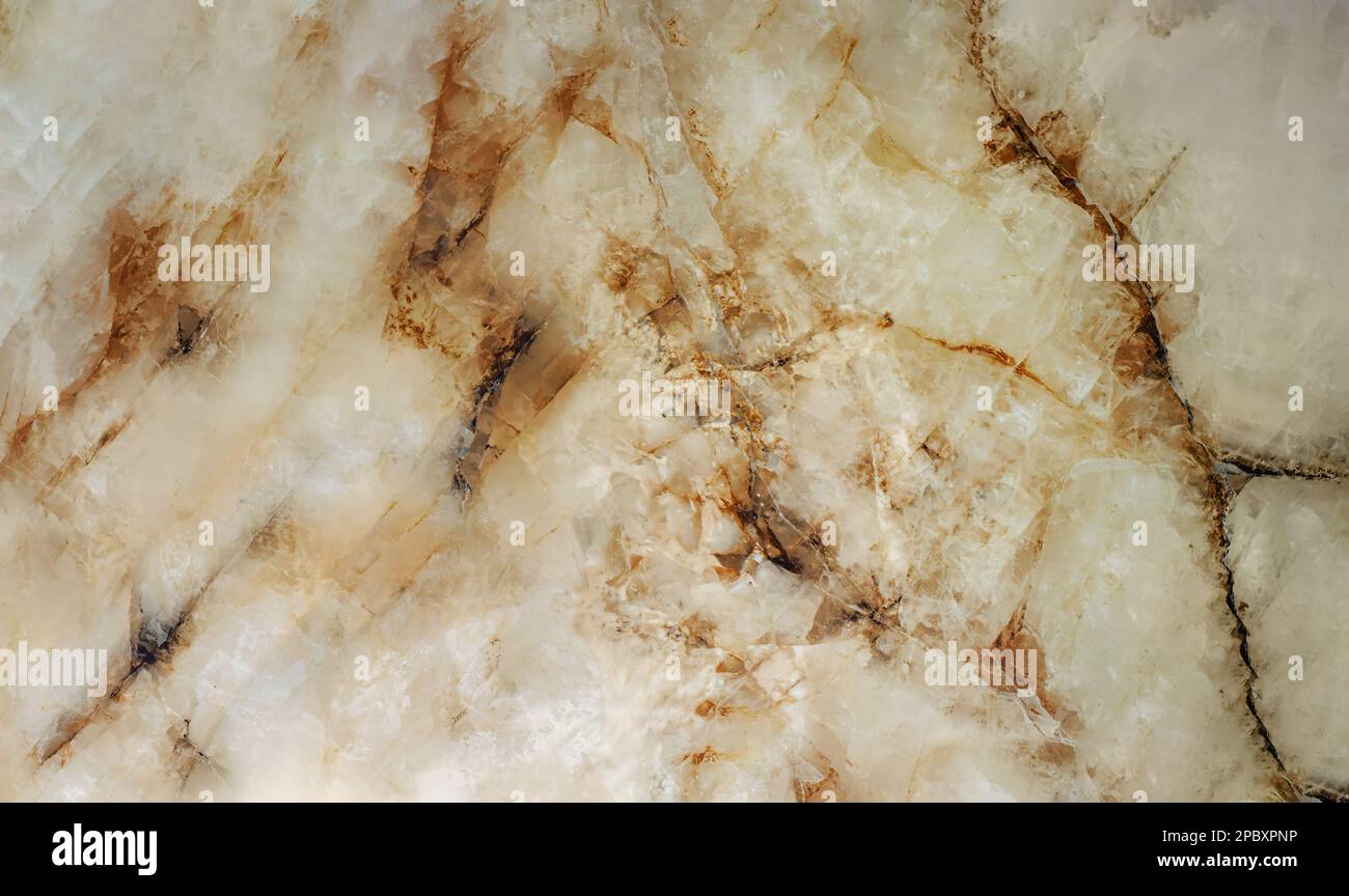 Large texture of marble slab in warm milky tones with rusty streaks Stock Photo