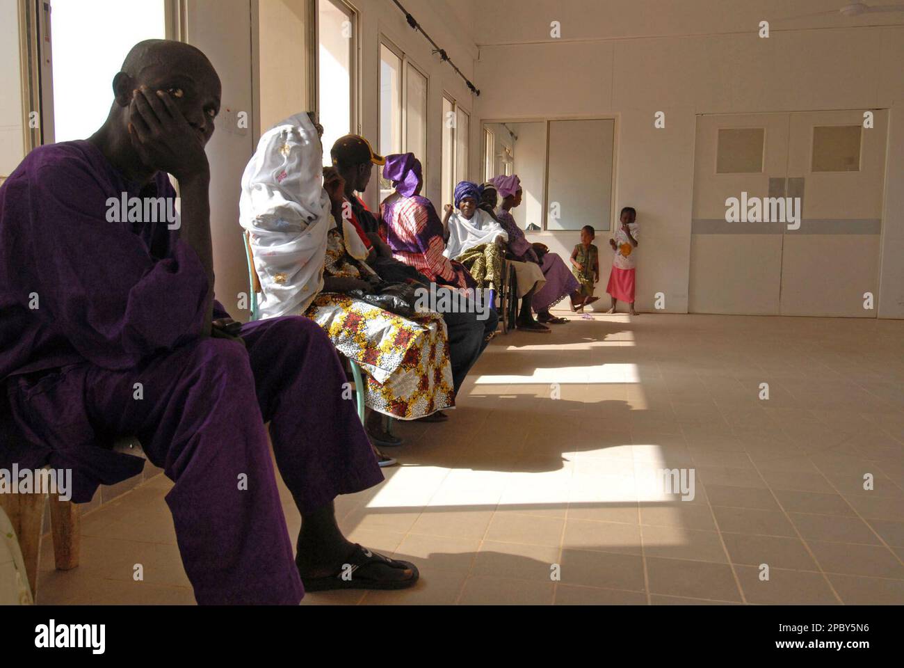 Patients await for an alleged herbal HIV treatment by Gambia's President  Yahya Jammeh, at Serrekunda Hospital in Banjul, Gambia, Friday, Feb. 16,  2007. Surrounded by bodyguards, the president of Gambia pulls on