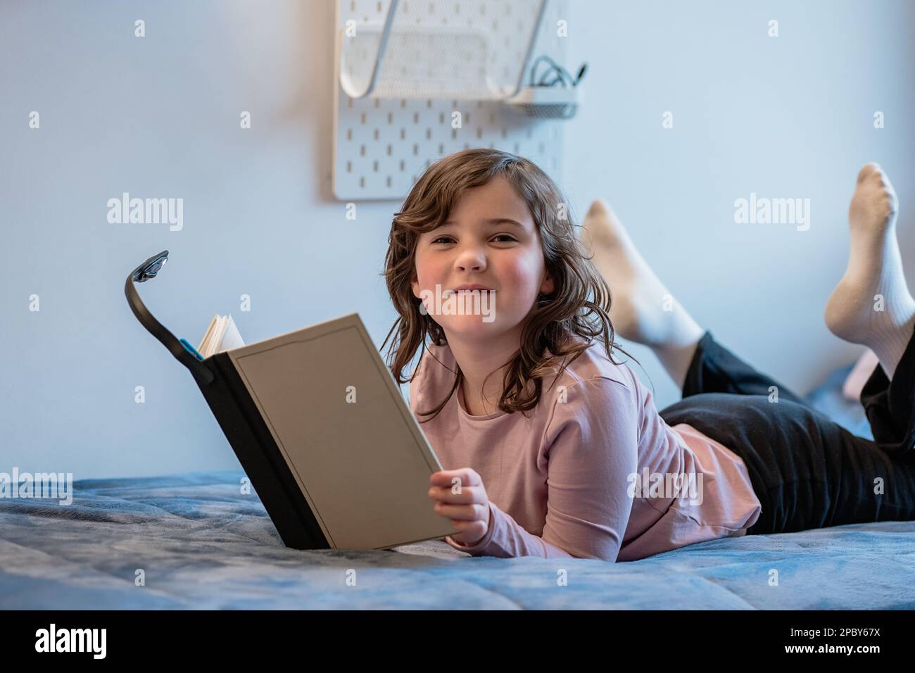 Preteen girl lying on bed hi-res stock photography and images - Alamy