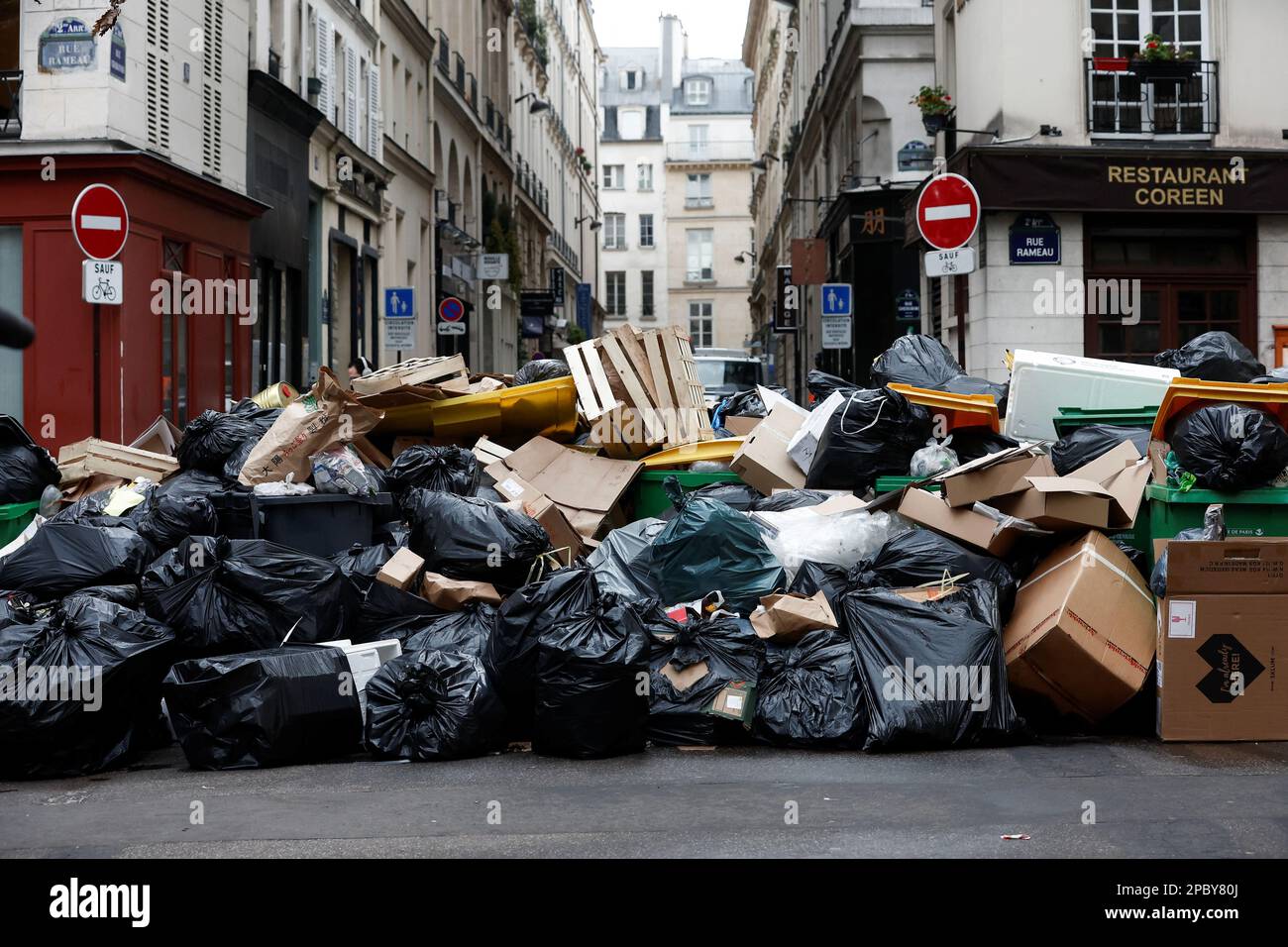 A view of a street where garbage cans are overflowing, as garbage has not been collected, in Paris, France March 13, 2023. REUTERS/Benoit Tessier     TPX IMAGES OF THE DAY Stock Photo