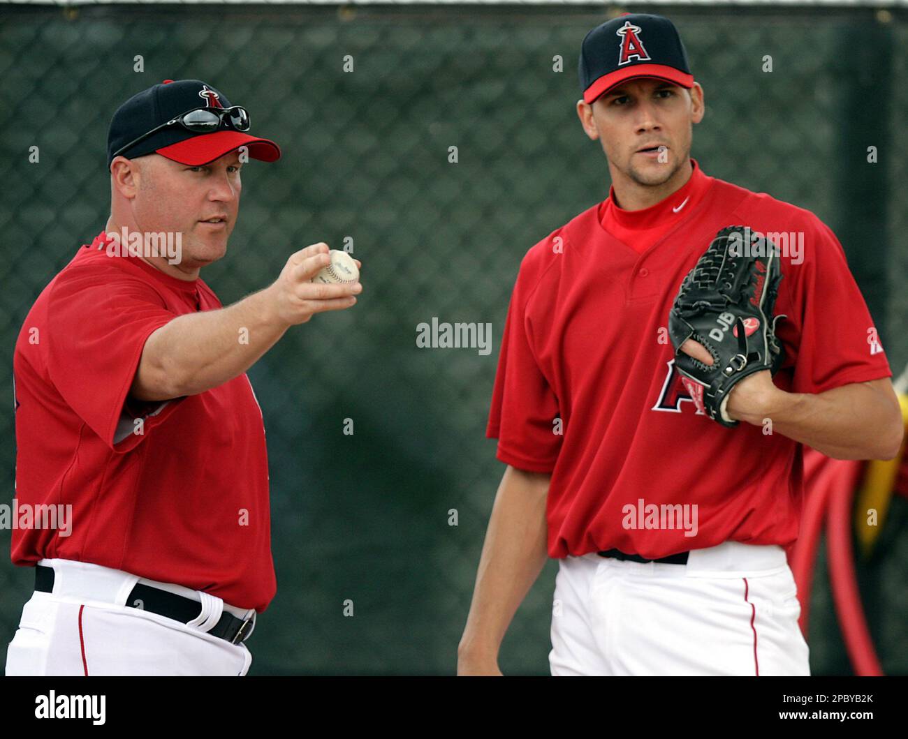 Anaheim Angels pitching coach Mike Butcher, left, instructs pitcher