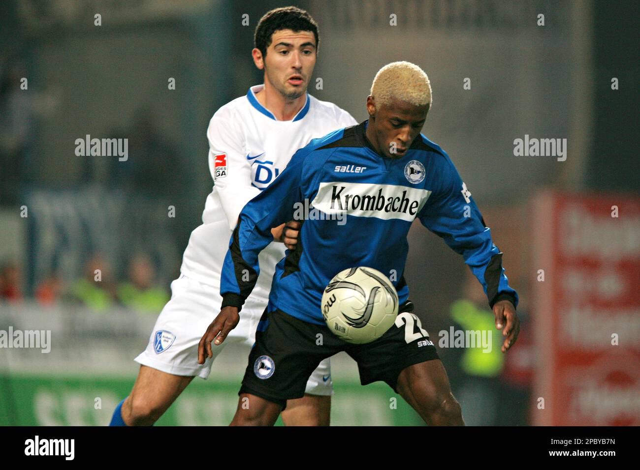 Bielefeld's Sibusiso Zuma, from South Africa, fights for the ball with Bochum's Anthar Yahia from Algeria, back, during German first division soccer match between Arminia Bielefeld and VfL Bochum at the SchuecoArena stadium in Bielefeld, western Germany, Sunday Feb. 18 2007. (AP Photo/Volker Wiciok) ** NO MOBILE USE UNTIL 2 HOURS AFTER THE MATCH, WEBSITE USERS ARE OBLIGED TO COMPLY WITH DFL-RESTRICTIONS, SEE INSTRUCTIONS FOR DETAILS ** Stock Photo