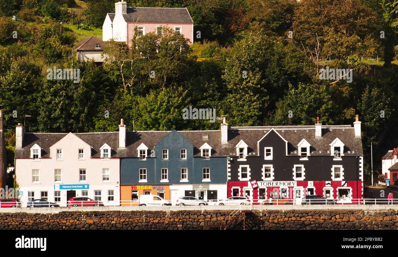 Looking over to the colourful buildings and shops on the seafront at Tobermory, Mull, Scotland