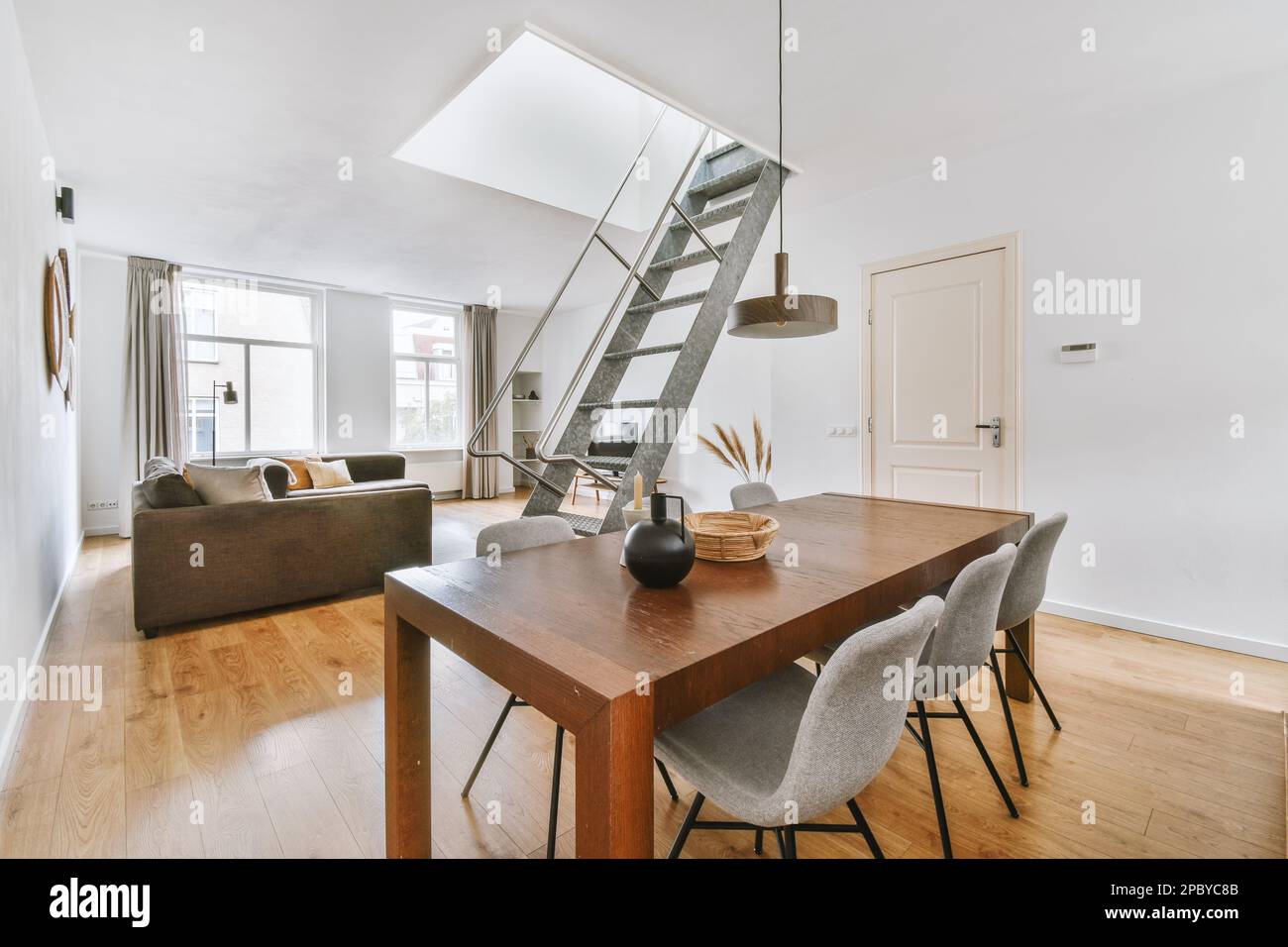 Interior design of dining room with wooden table and chairs with