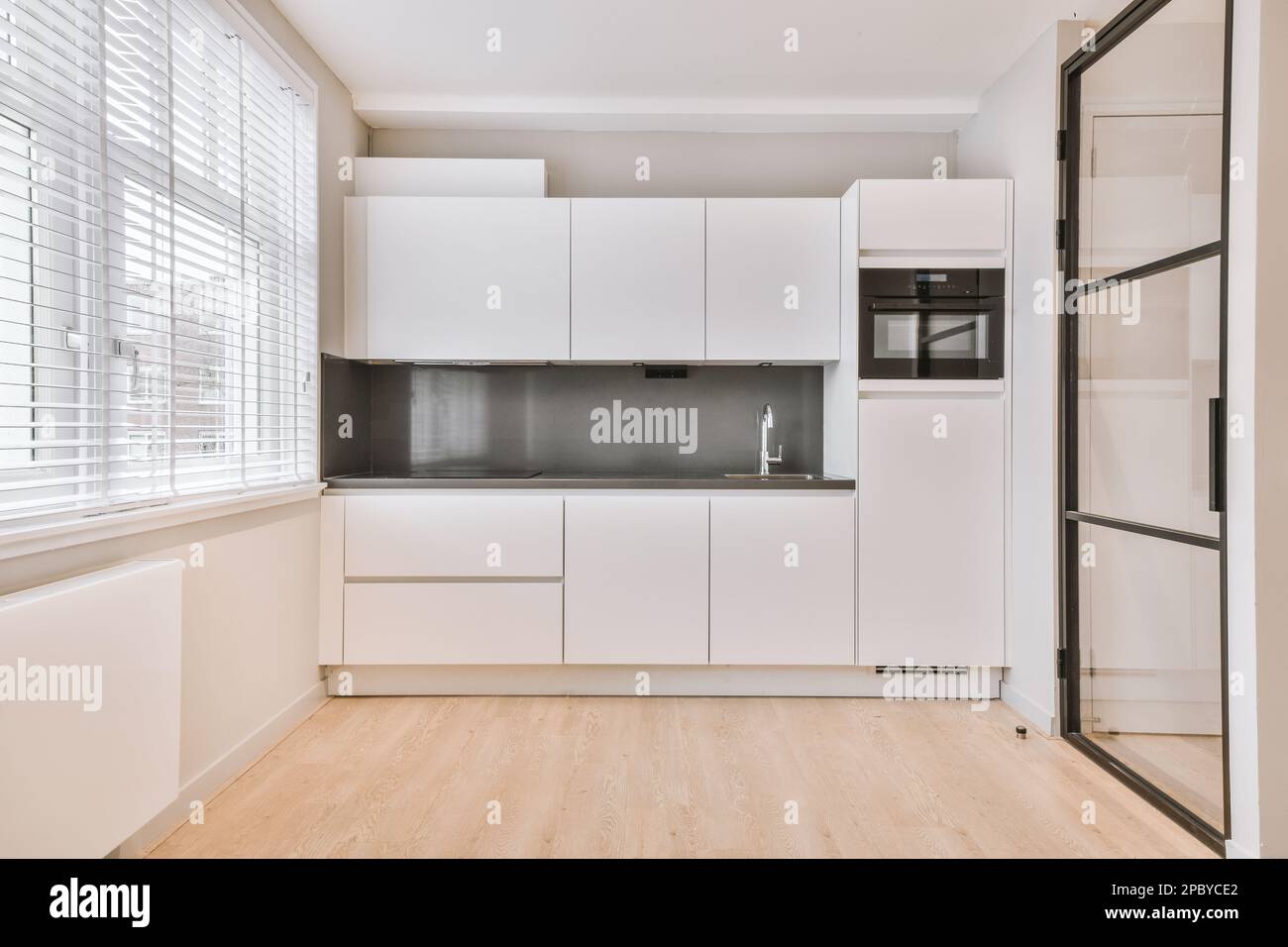 Interior design of modern spacious kitchen with big windows and wooden ...