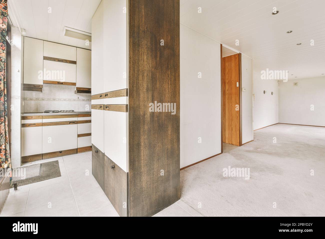 Fresh Look at Interior Of Kitchen With Cupboards And Built In Oven Against
