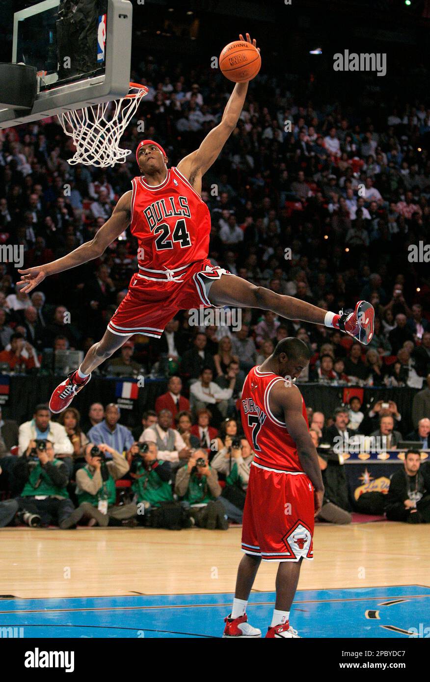 Chicago Bulls' Tyrus Thomas, top, dunks over his teammate Ben Gordon during  the slam dunk contest at NBA All-Star Saturday Night in Las Vegas,  Saturday, Feb. 17, 2007. (AP Photo/Jae C. Hong