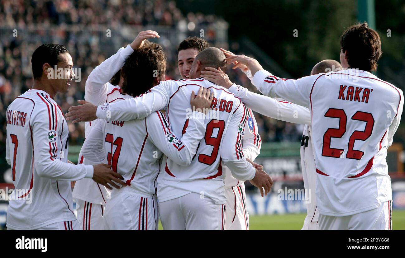AC Milan's Ronaldo, (99) at center with back to camera, celebrates with his including Ricardo Oliveira of Brazil, left, and Kaka', also from Brazil, after scoring against Siena during the Italian