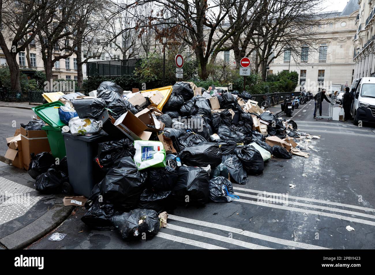 A view of a street where garbage cans are overflowing, as garbage has not been collected, in Paris, France March 13, 2023. REUTERS/Benoit Tessier Stock Photo