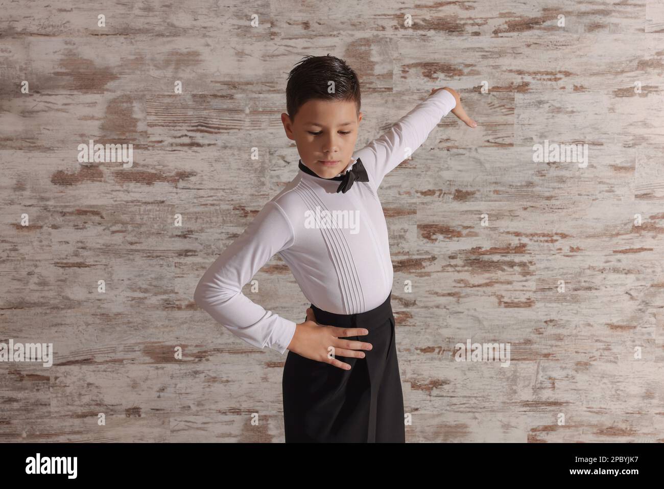Beautifully dressed little boy dancing in studio Stock Photo Alamy