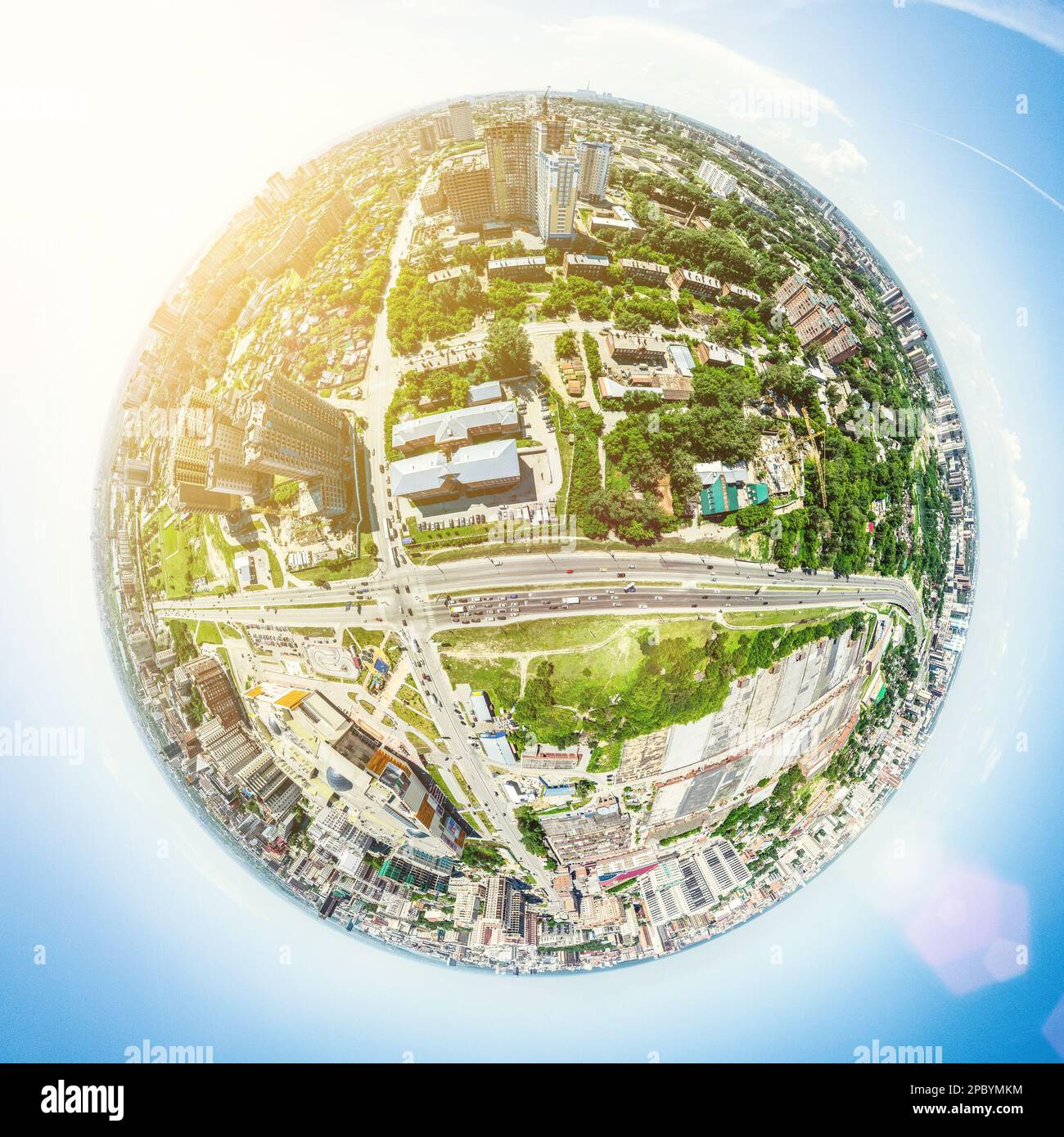Aerial city view with crossroads and roads, houses, buildings, parks ...