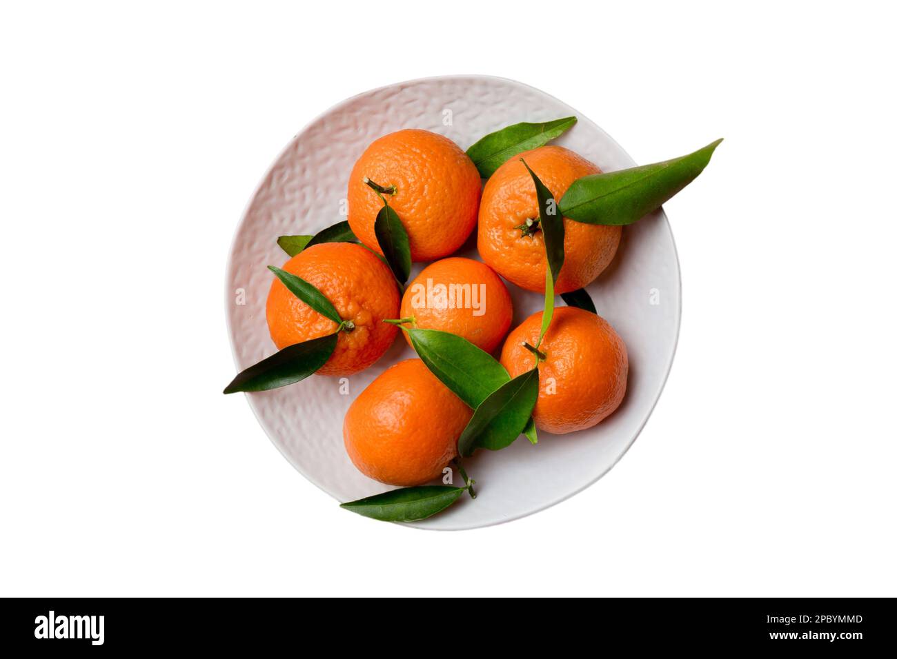 Fresh cutted clementines and whole mandarin over round plate isolated