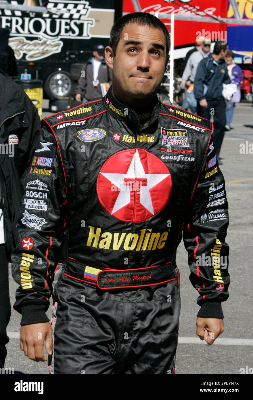 NASCAR driver Juan Pablo Montoya, of Colombia, walks through the garage ...