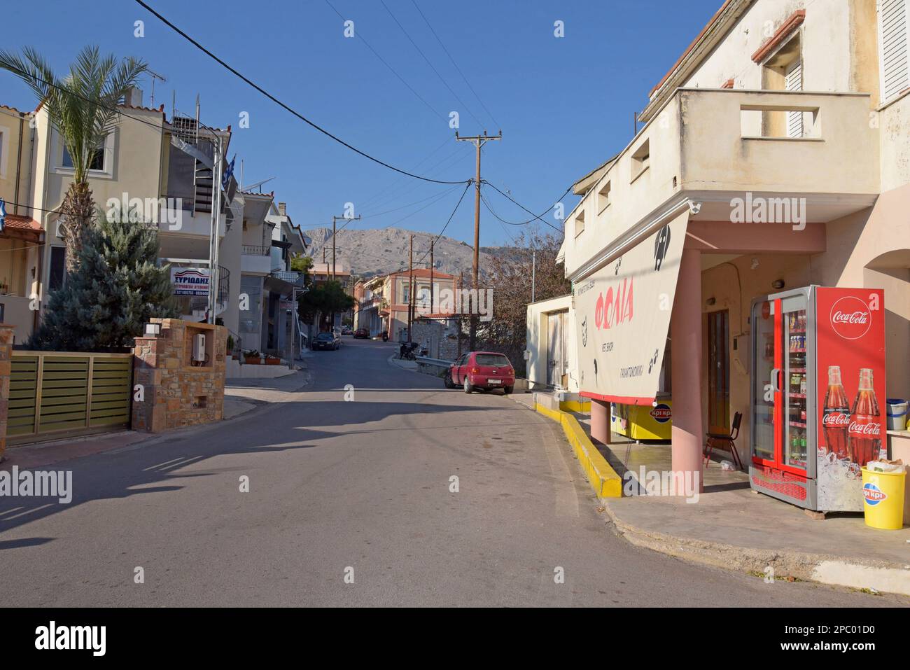 A back street and corner shop grocery store in Vrontados, island of Chios, Greece Stock Photo