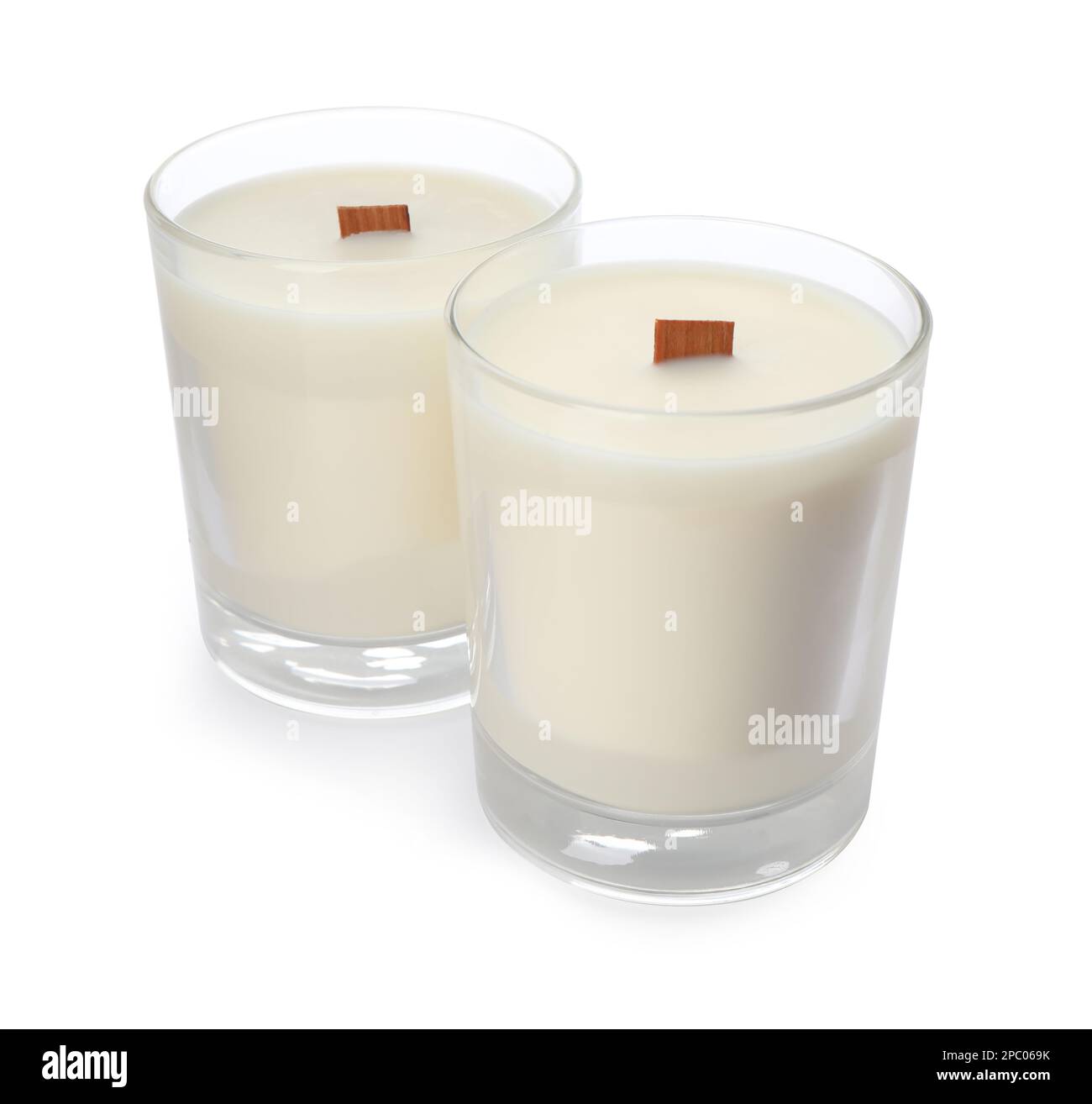 Aromatic soy candles with wooden wicks on white background Stock Photo