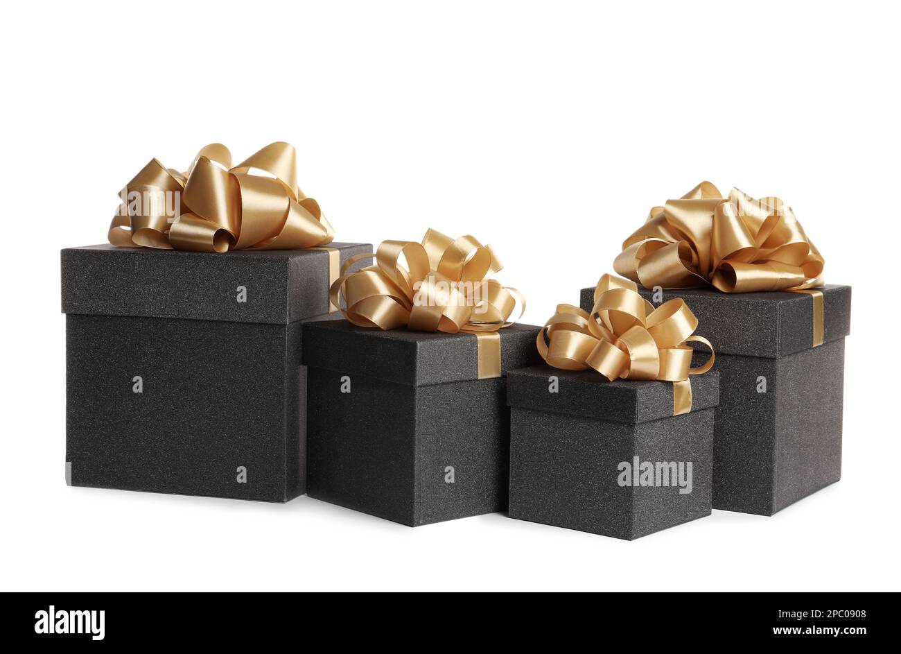 Black gift boxes with golden bows on white background Stock Photo - Alamy
