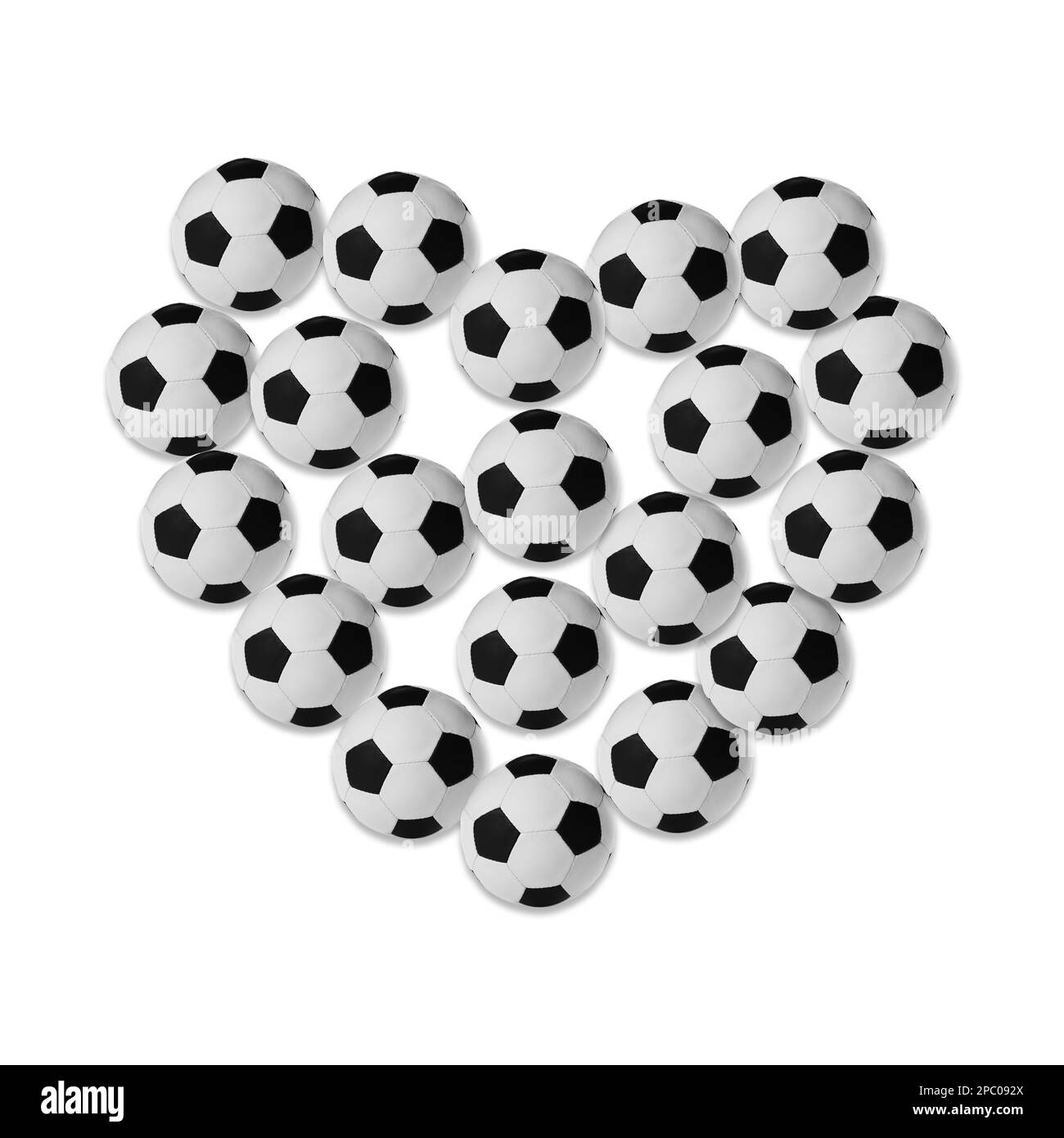 Heart made of many soccer balls on white background Stock Photo
