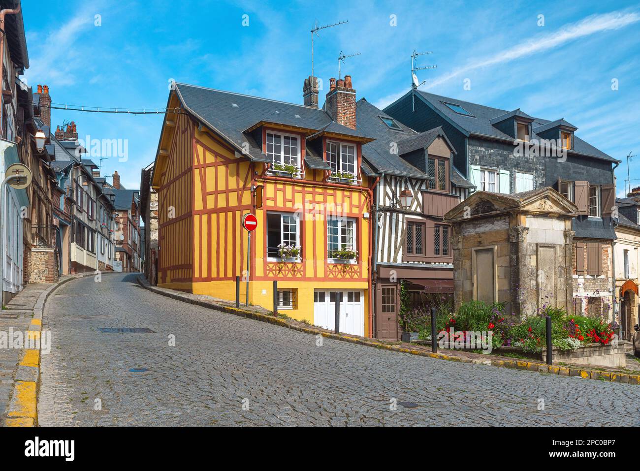Old cozy street with timber framing houses in Honfleur, Normandy, France. Architecture and landmarks of Honfleur, Normandie Stock Photo